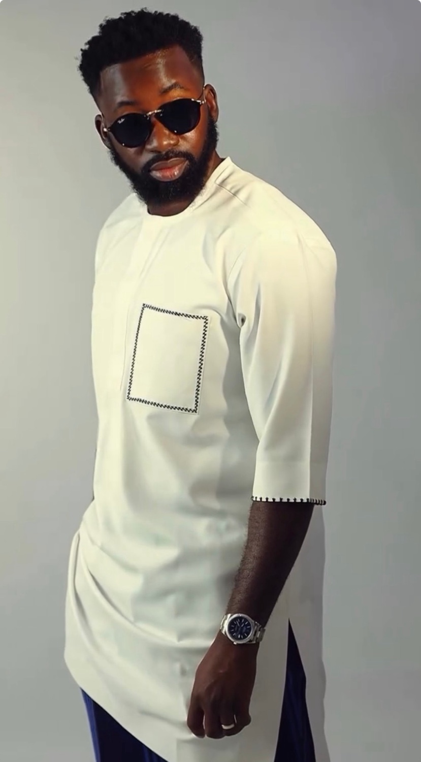 The founder of JRYM Bespoke in an ivory kaftan with a hand-stitched pocket